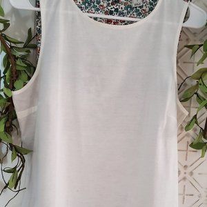 Sleeveless shirt, cotton blend, size Small.  Solid Ivory front, floral back